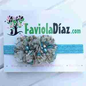 Vincha Celeste con Flores Bianca